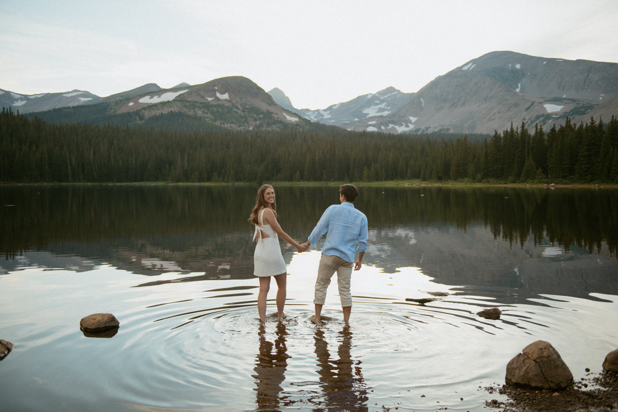 A couple walks into Brainard lake hand in hand