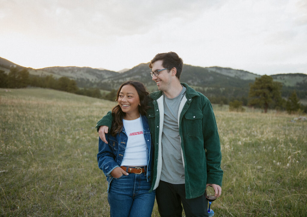 A couple holds each other close during sunset in the foothills of Golden, Colorado