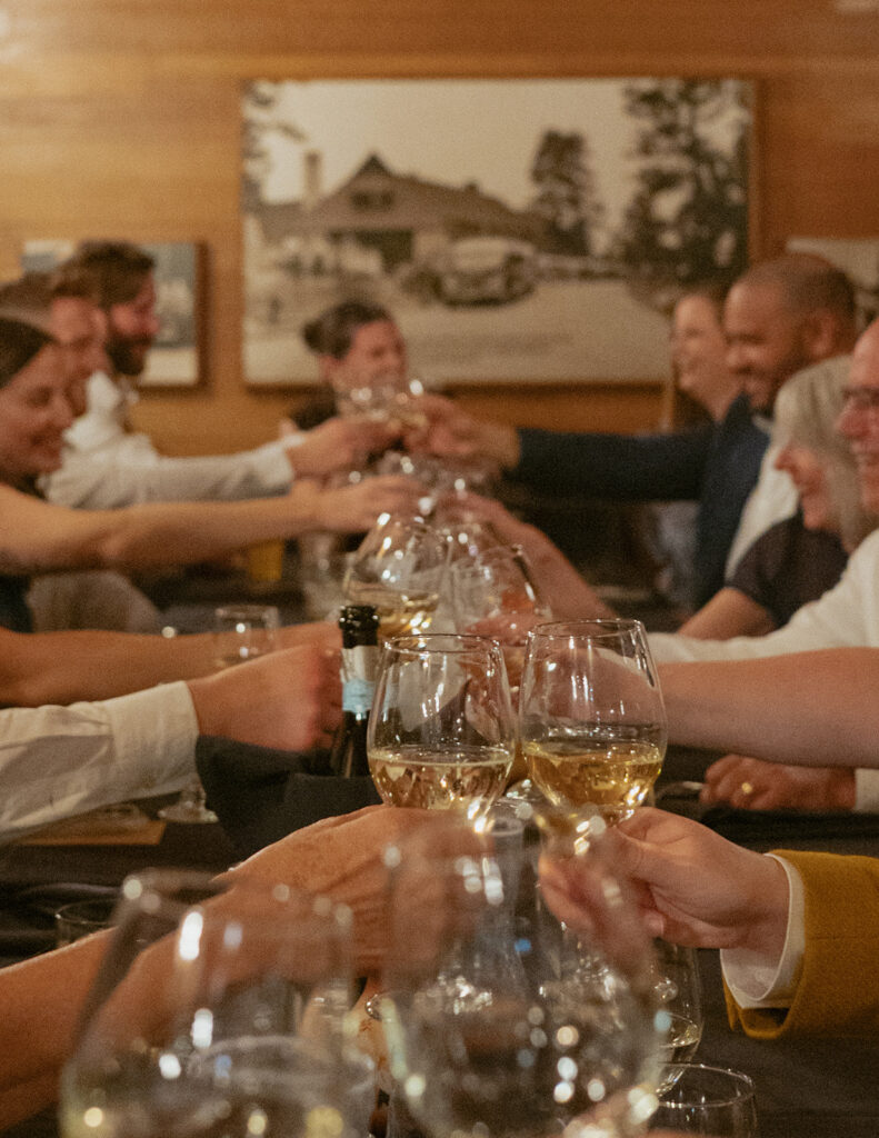 guests cheers one another at a wedding reception